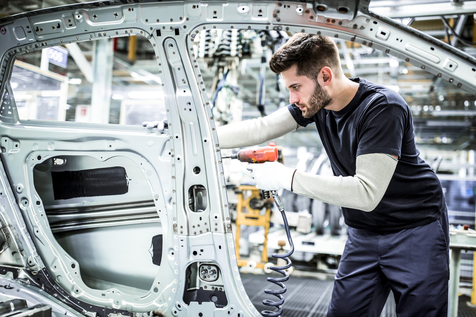 Man working in modern car factory