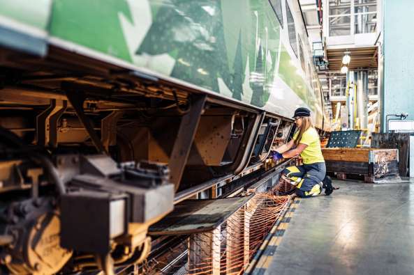 Woman repairing a train