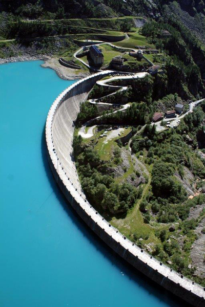 dam reservoir mountainside switchback road