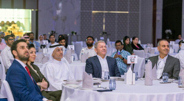 people seated at tables in ballroom