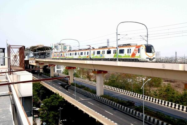 India commuter train on elevated track 