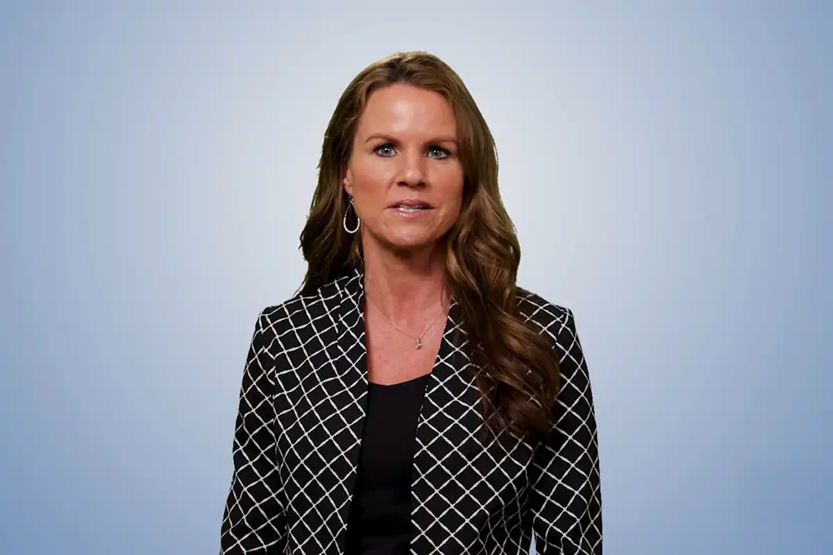 Salena Butler, SVP of Infor Channels, speaking with a partner