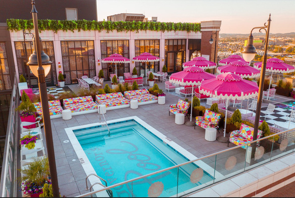 hotel rooftop pool umbrellas tables