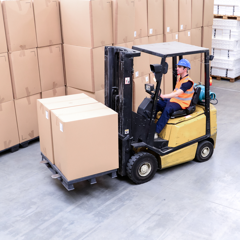 Forklift truck drivers in a warehouse. Global Transportation