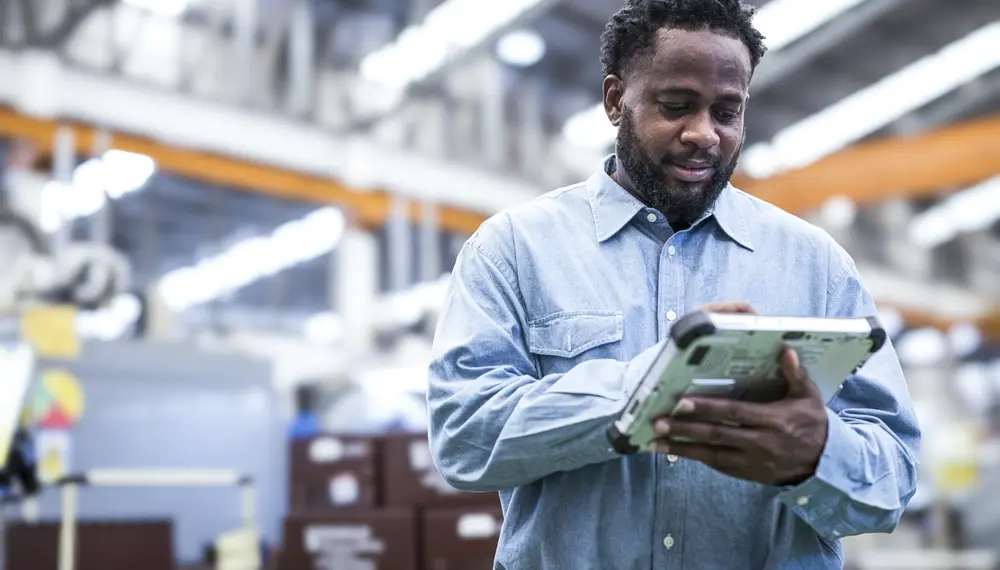 Electricity distributor using Infor Industry AI on a tablet