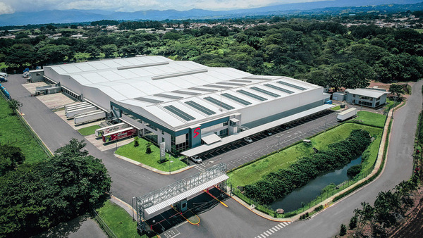 GrupoServica warehouse exterior with green grounds 