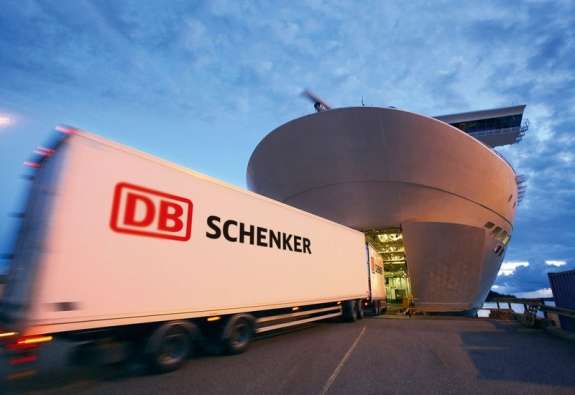 photo of a db schenker truck driving into a large ship