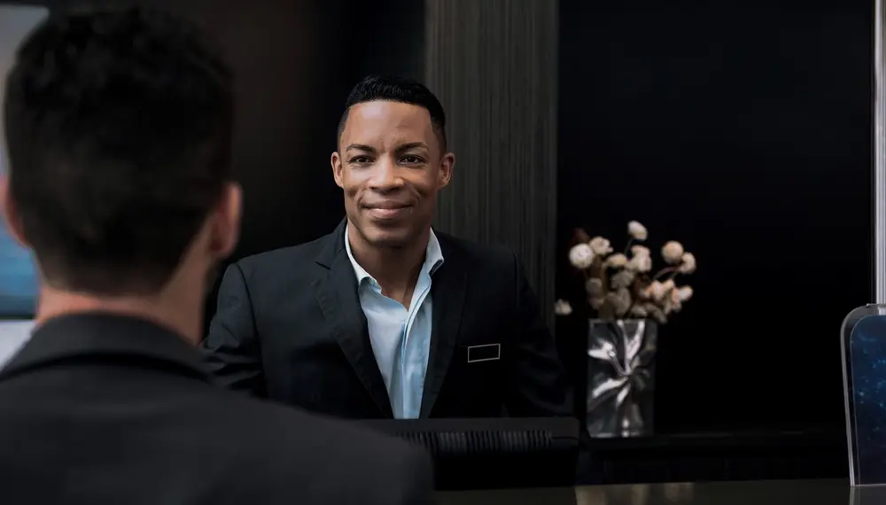 Hotel concierge helping a guest check-in 