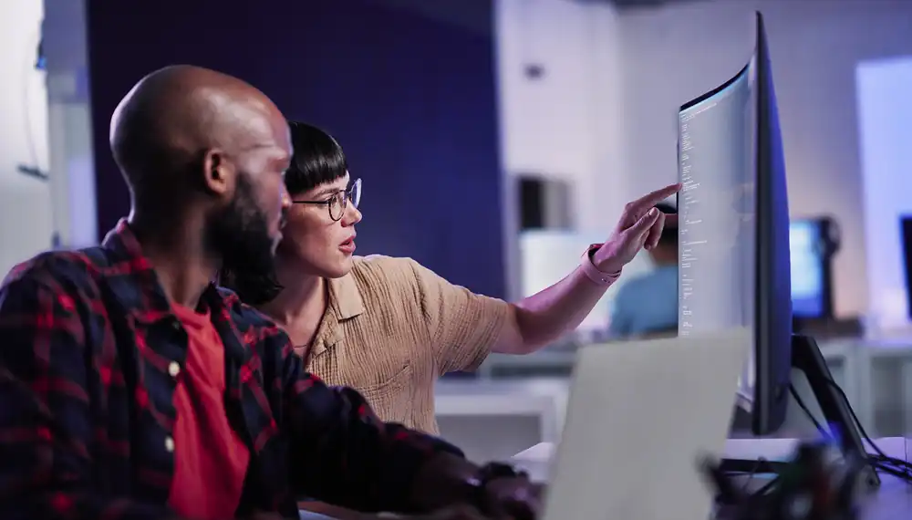 Colleagues reviewing the Infor Leap ERP cloud migration program on a desktop computer