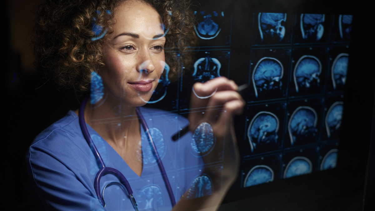 Healthcare provider reviewing medical imaging scans