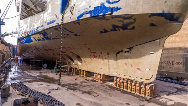 ship hull under repair in drydock