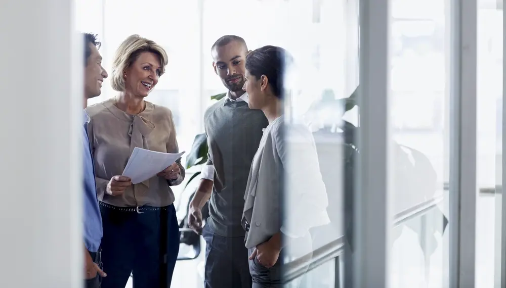 A team meeting in a glass office