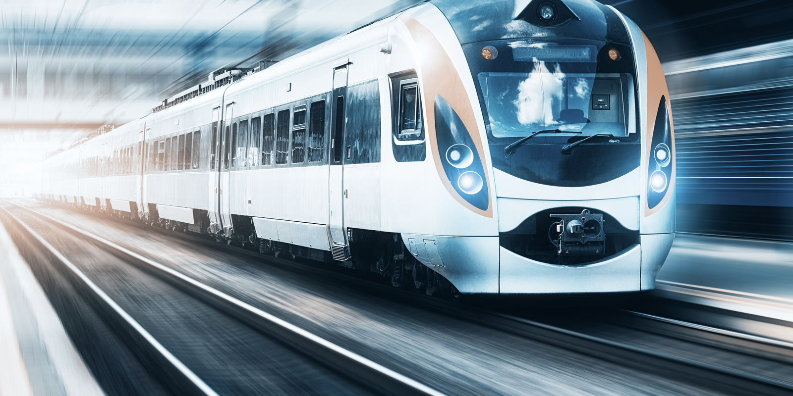 High speed train at the railway station at sunset in Europe