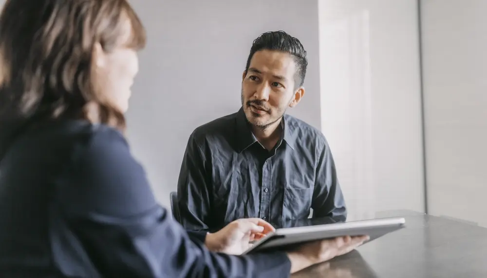 Man meeting Infor consultant for advisory services