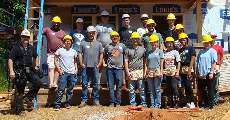 Infor volunteers in front of the latest Habitat for Humanity build in Greenville