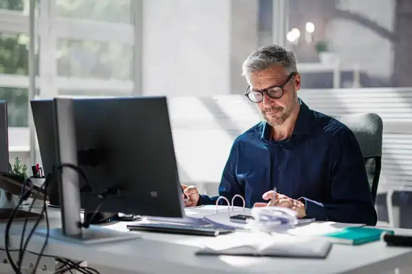Executive researching AI use case packs in his office