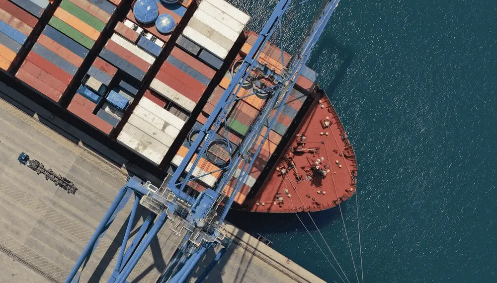 Cargo ship being loaded in a port 