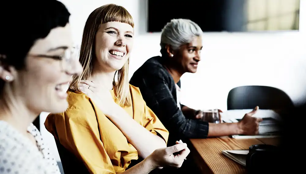 Team laughing in a meeting 