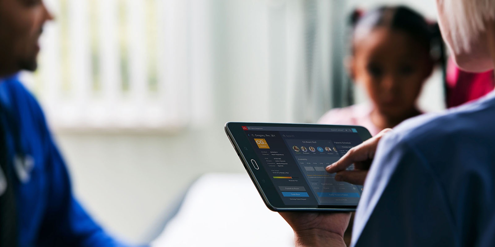 Doctor using population health analytics on a tablet