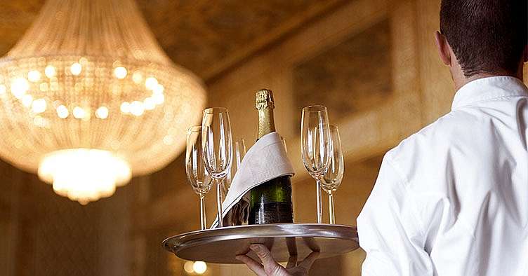 Champagne glasses and champagne bottle on a tray