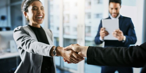 1159390255 handshake woman smiling&#xA;  business 