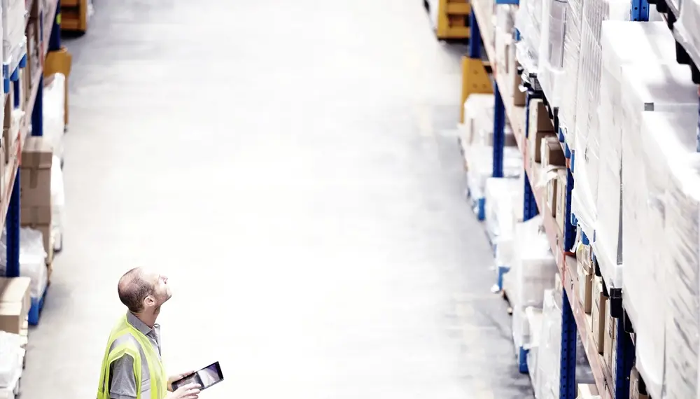 Warehouse worker using a tablet