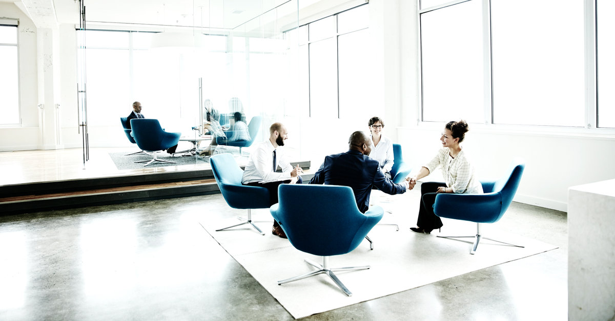 businesswoman shaking hands with client meeting in office