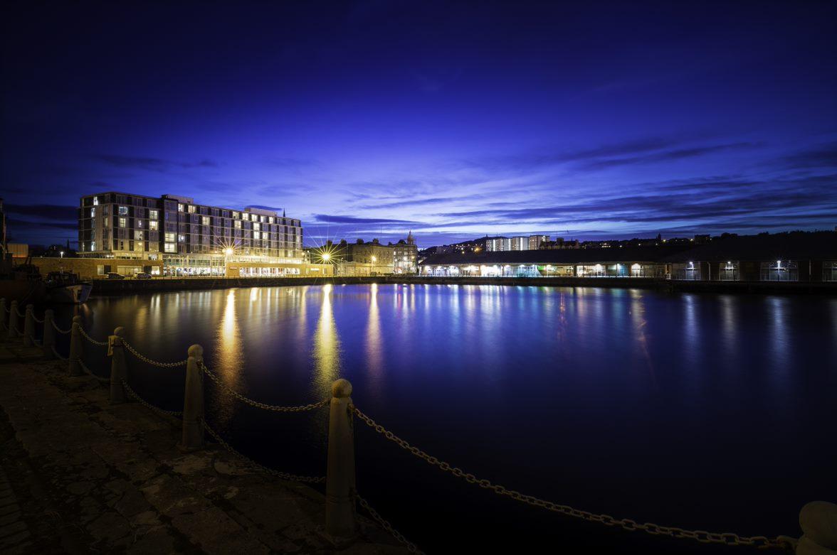 photo of the outside of a london property at night