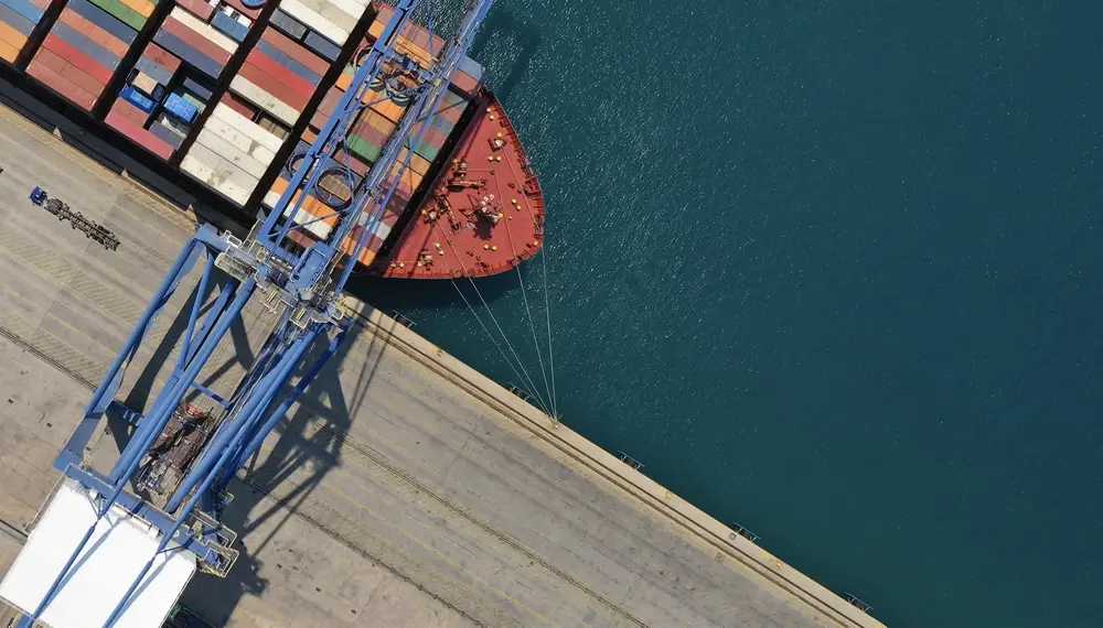 Cargo ship being loaded in a port 