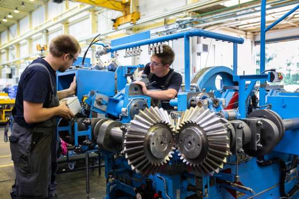 Two man at work in a factory