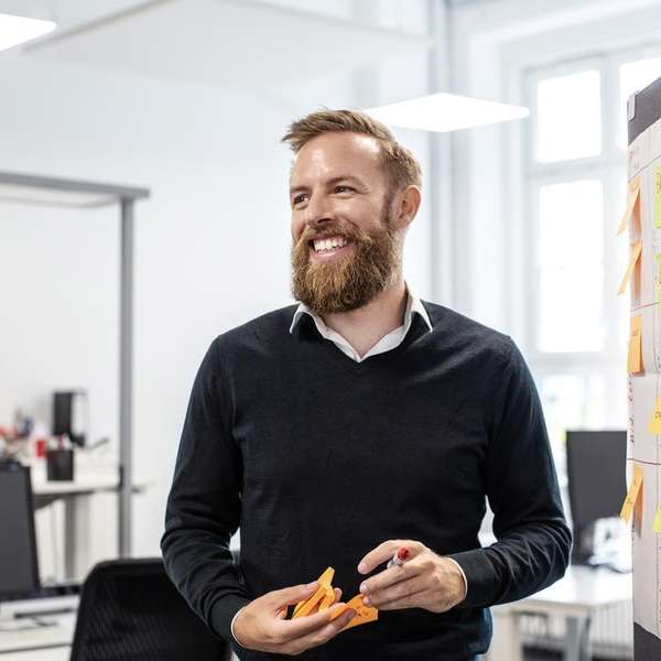 male smiling whiteboard office germany
  HR
