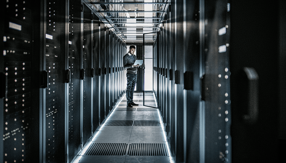 A person standing in a server room