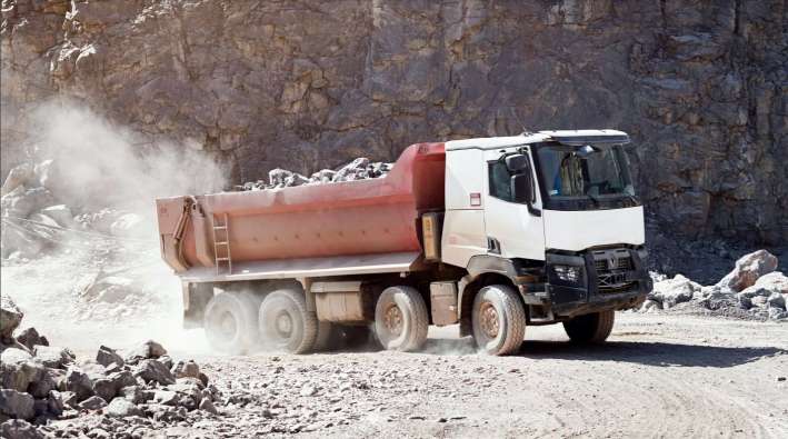photo of a truck carrying asphalt