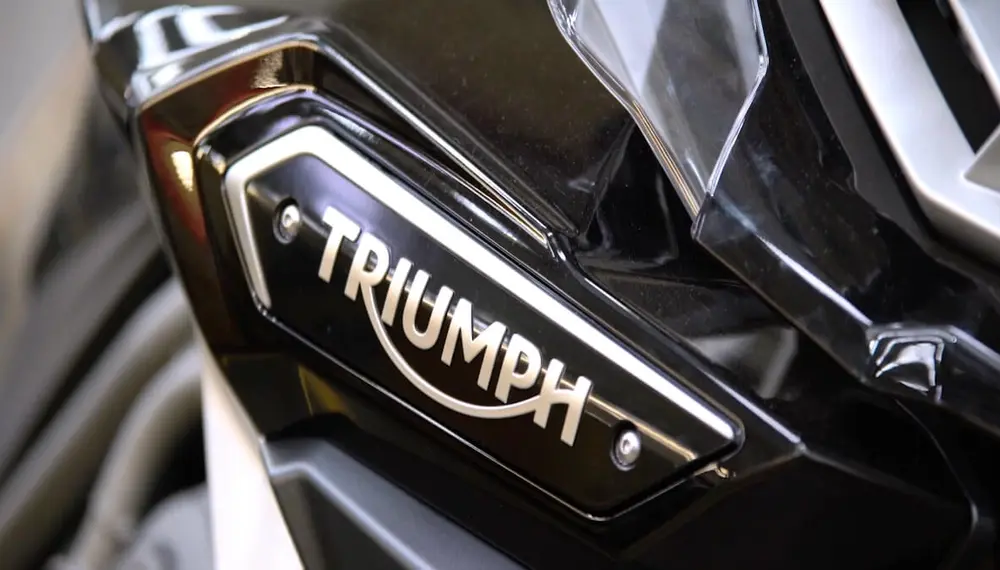 Close-up of the Triumph logo on a motorbike