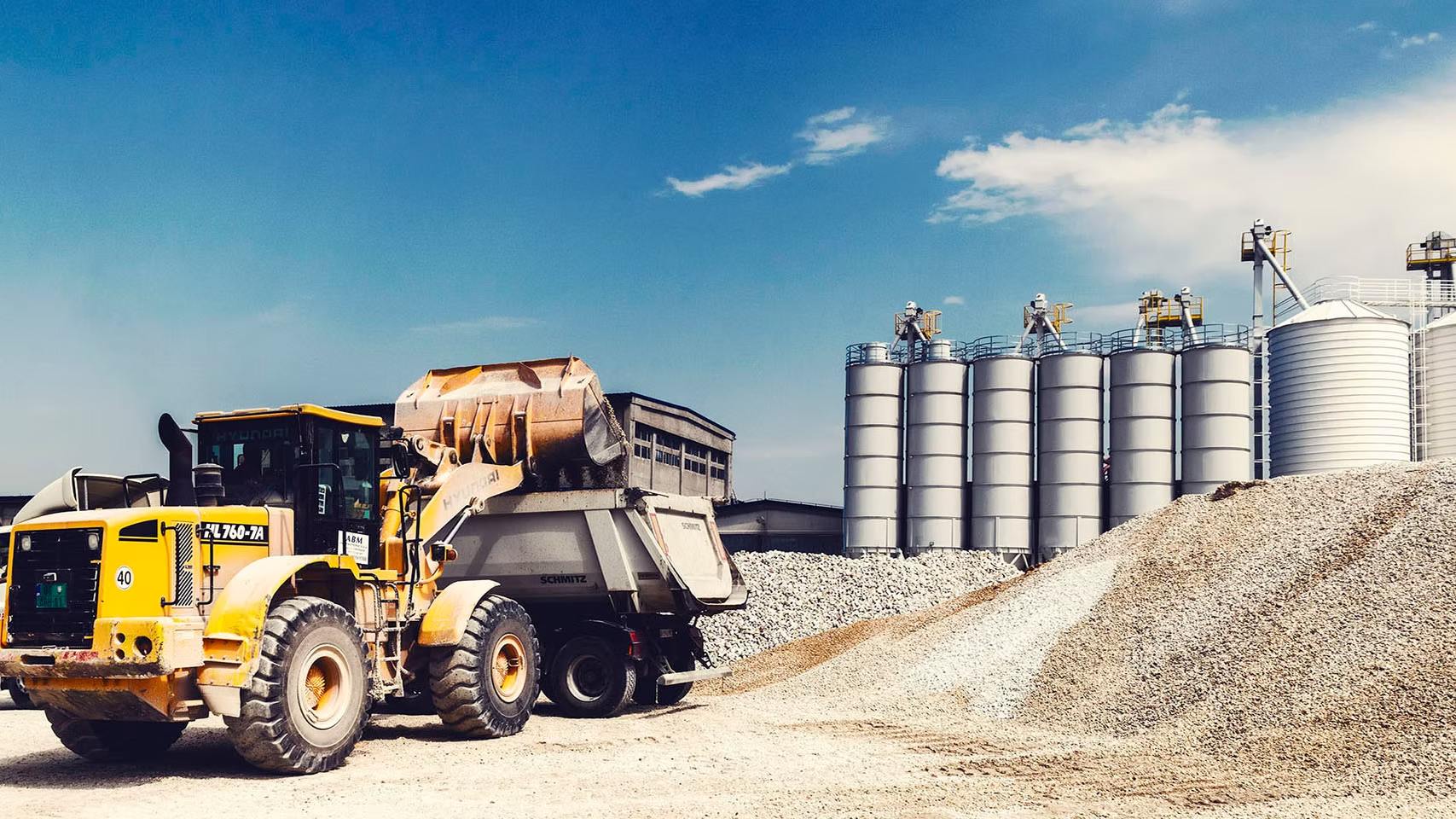 dump truck getting loaded with gravel