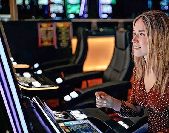 A player at a casino sits in front of a gaming machine