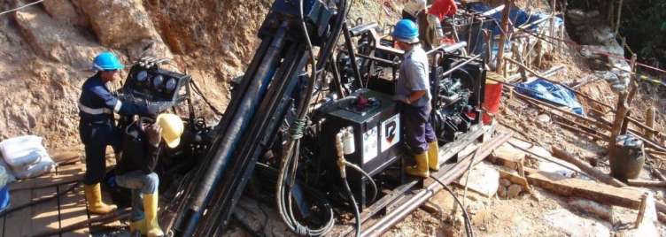 Workers drilling in mine