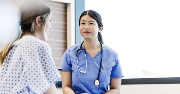 Nurse-smiles-proudly-patient_Getty