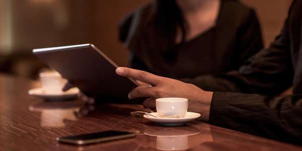 business man woman sitting hospitality   order hotels bar digital tablet  
