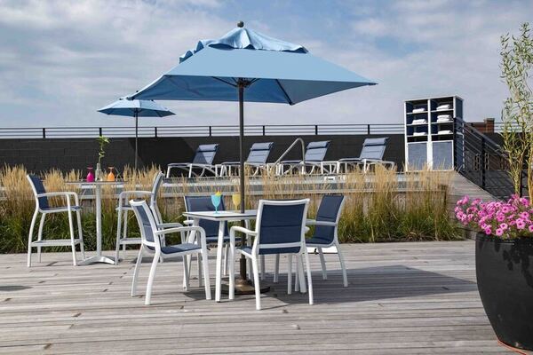 table chairs umbrella on deck