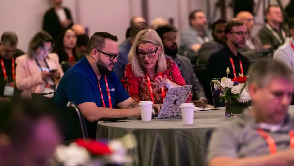 Attendees in a workshop at an Infor Velocity Week event