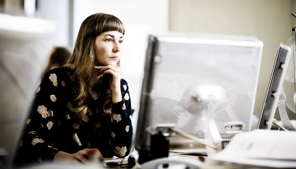 Woman working at a computer in an office