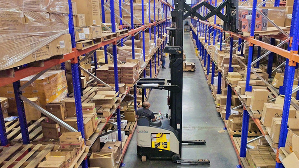 GrupoServica warehouse with vertical forklift