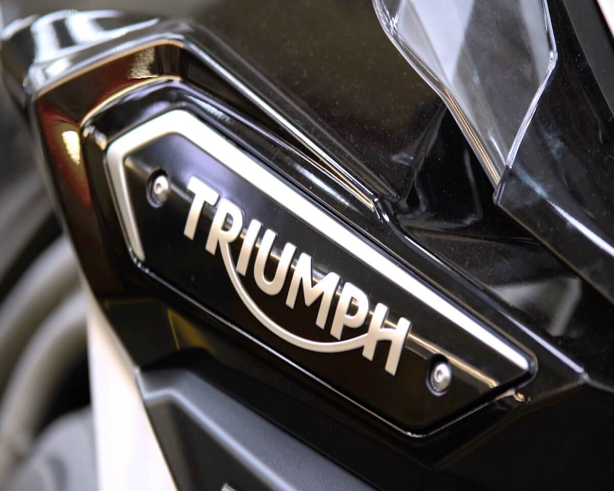 Close-up of the Triumph logo on a motorcycle