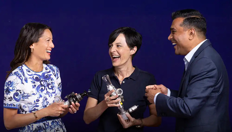 Three executives laughing