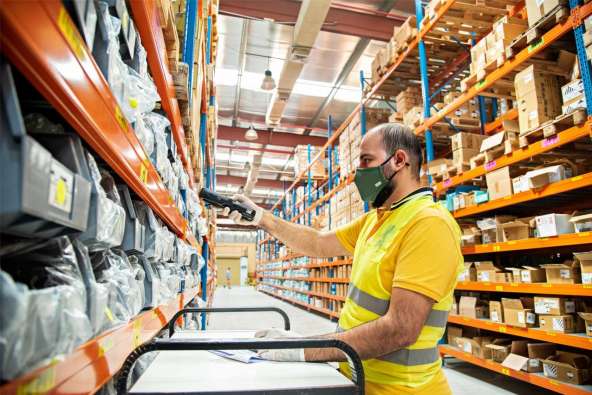 Warehouse worker scans items