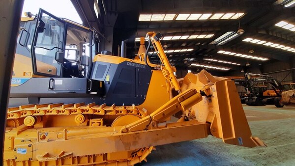 yellow  digger with track and plow