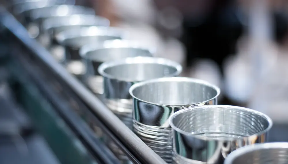 Empty cans running on automatic conveyor belt