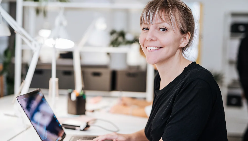 Employee browsing Infor U coxurse catalog on a laptop
