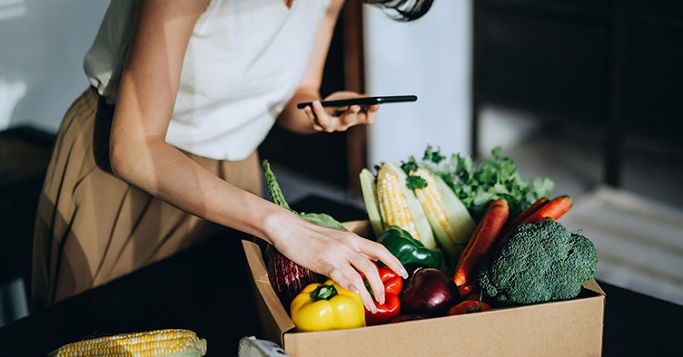 Woman checking groceries